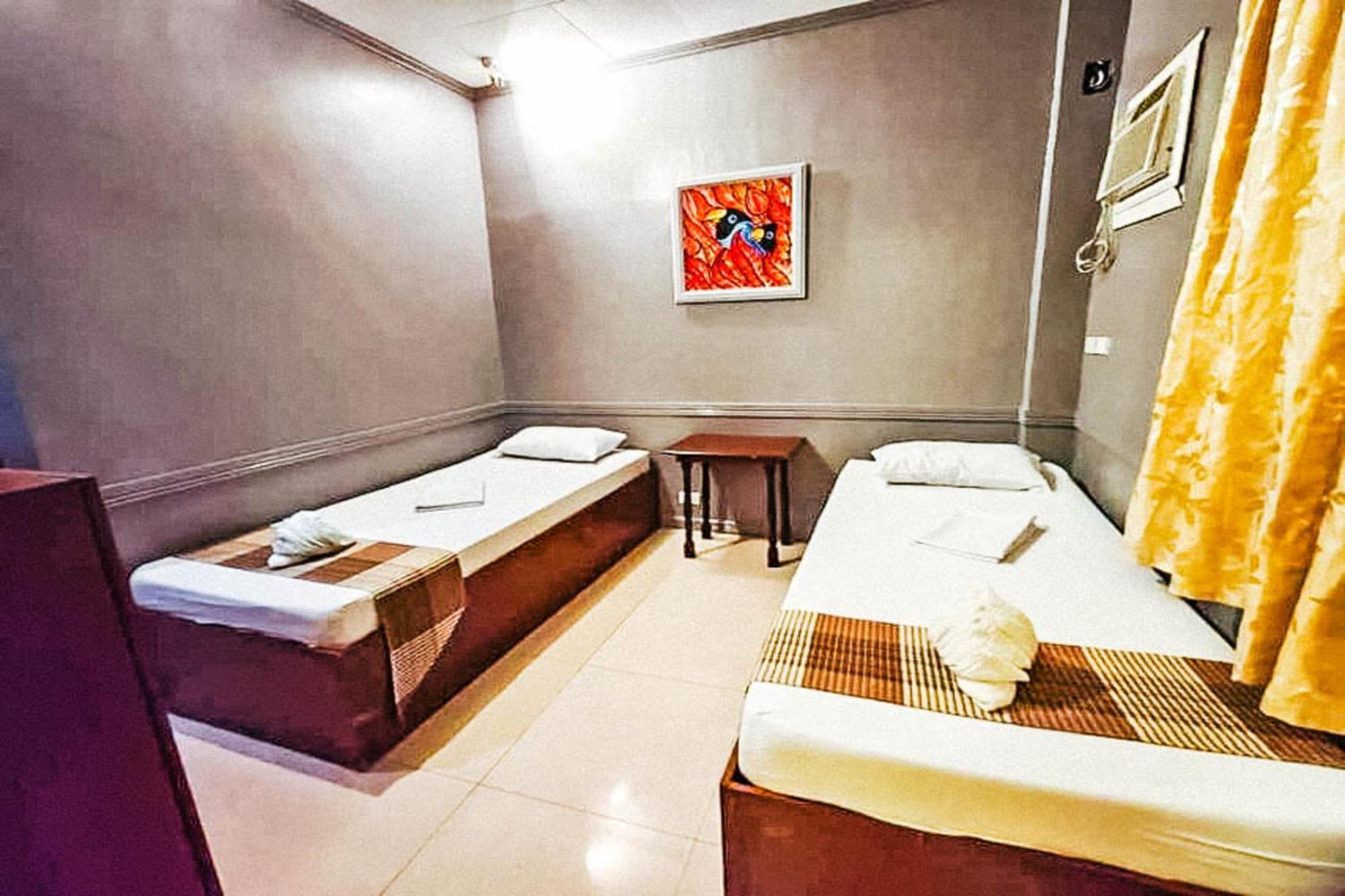 Mbg Travellers Inn Powered By Cocotel Puerto Princesa Kamer foto