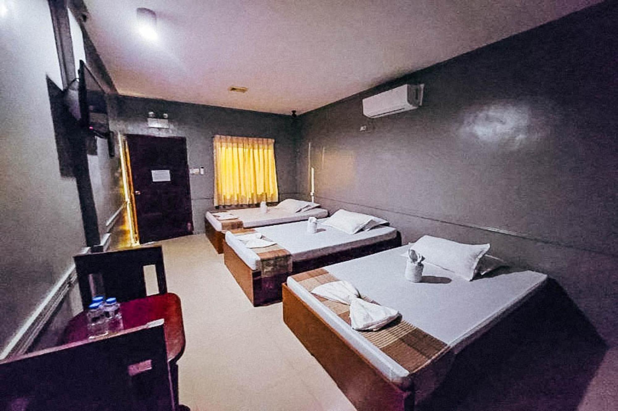 Mbg Travellers Inn Powered By Cocotel Puerto Princesa Kamer foto