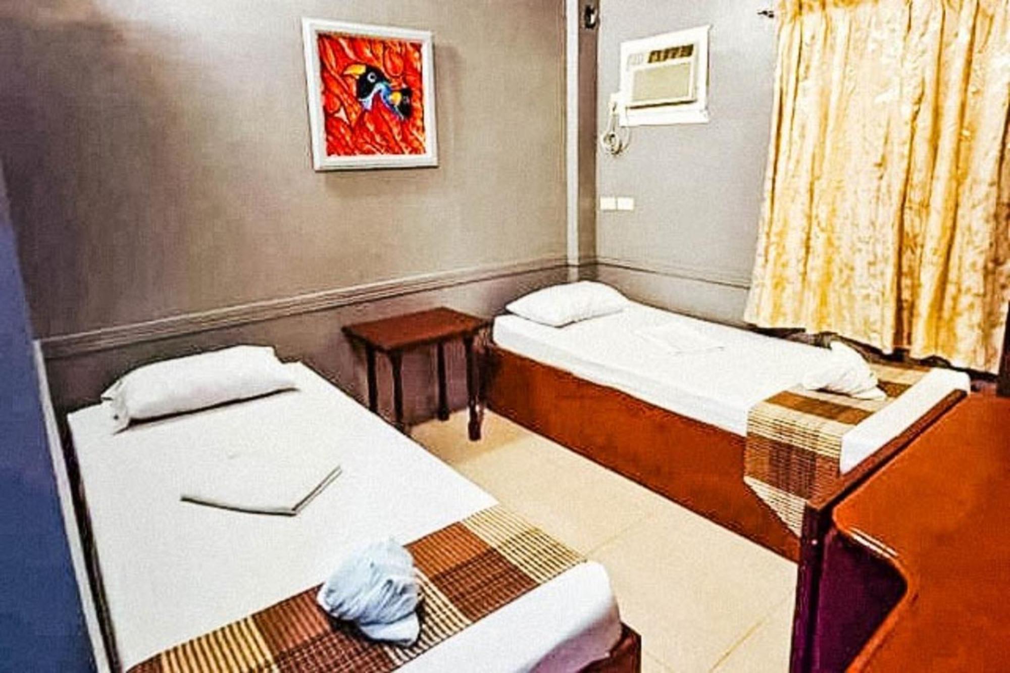 Mbg Travellers Inn Powered By Cocotel Puerto Princesa Kamer foto