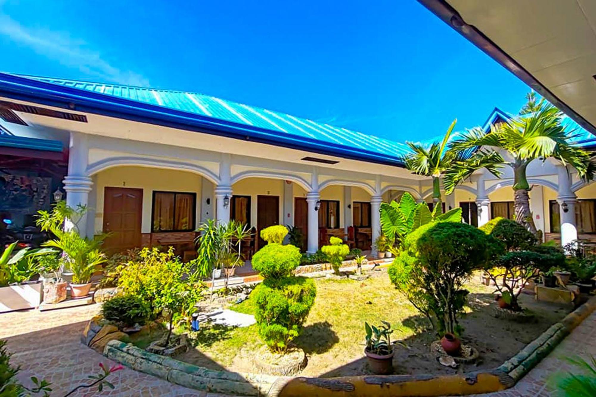 Mbg Travellers Inn Powered By Cocotel Puerto Princesa Buitenkant foto